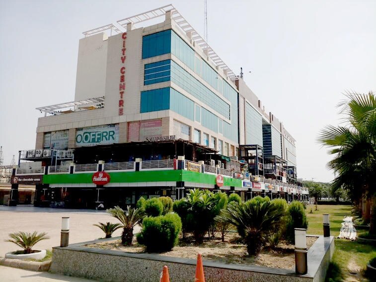 Sector 15 Dwarka_a large building with a large sign on top of it