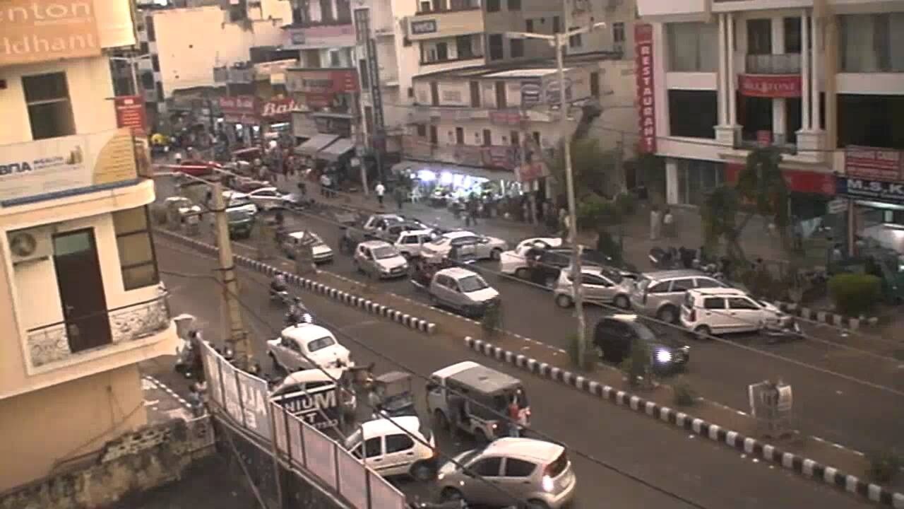 Sector 7 Dwarka_a city street filled with cars and trucks