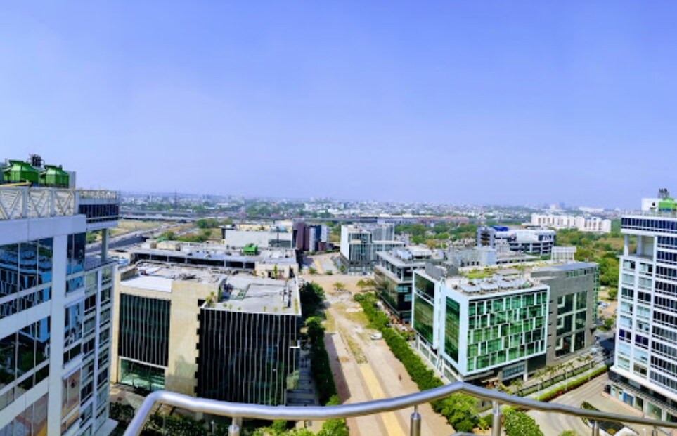 Shaheen Bagh_a large city with tall buildings and a sky background