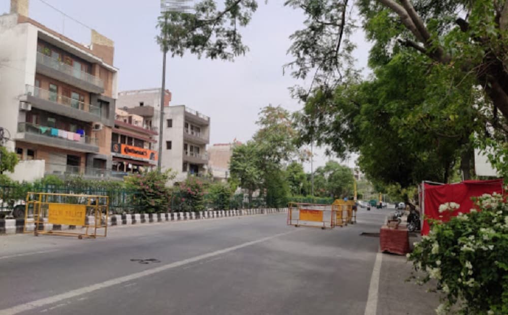 Shakti Nagar_a city street filled with lots of parked cars