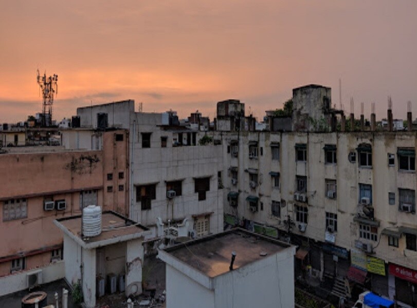 Shakti Nagar_a large building with a clock on top of it