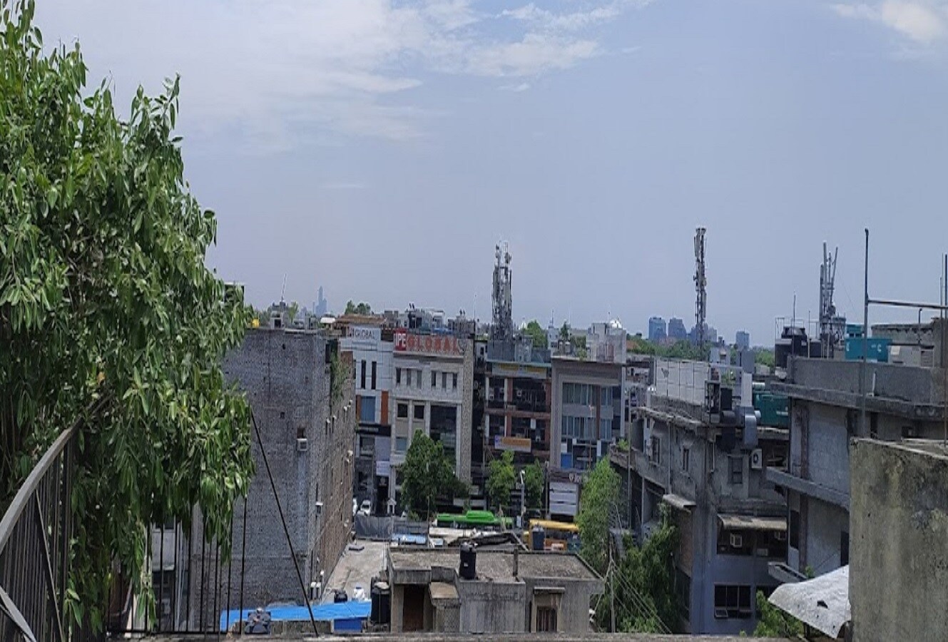 South Extension I_a city scene with a river and buildings