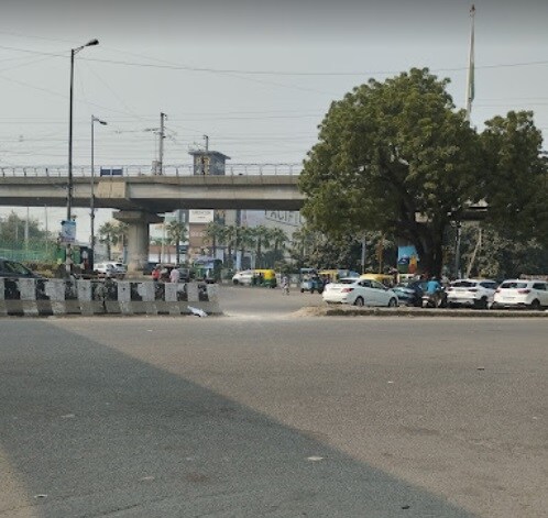 Subhash Nagar_a city street filled with cars and a traffic light