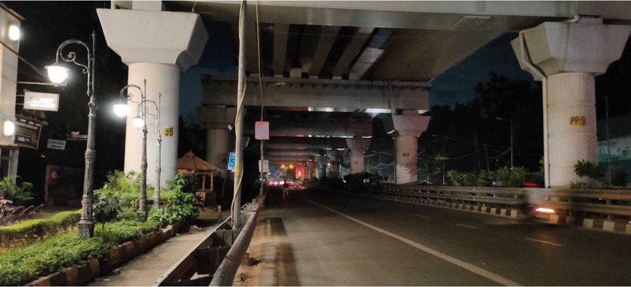 Sultanpur_a train crossing a bridge over a city street