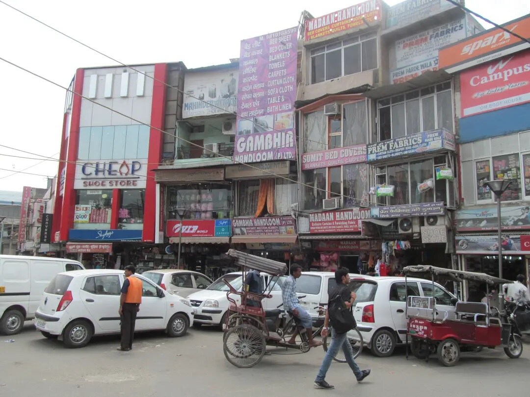 Tilak Nagar_motorcycles are parked in front of a building