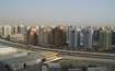 Al Qusais_a city with a lot of tall buildings