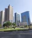 Barsha Heights (Tecom)_a city street with tall buildings and tall buildings