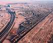 Jumeirah Village Triangle (JVT)_an aerial view of a city with many train tracks