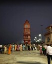 Garhmukteshwar_a crowd of people standing in front of a clock tower