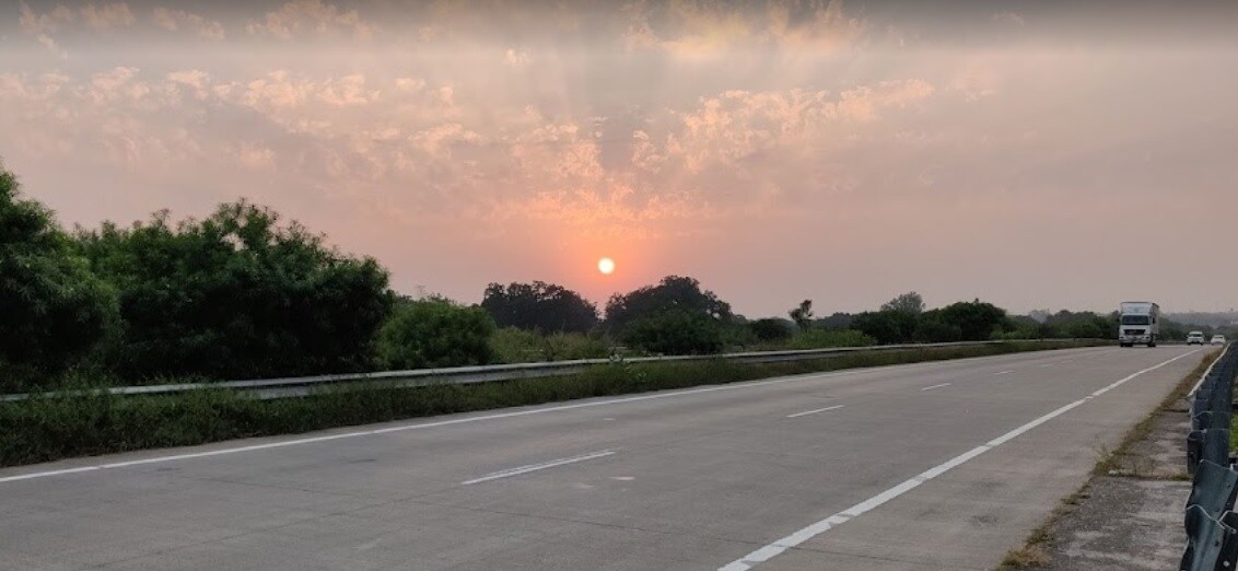 Gt Road_a view from a car of a road with a sunset