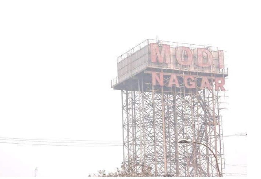 Modinagar_a large building with a sign on top of it