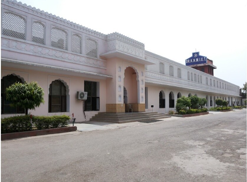 Modinagar_a large building with a clock on the front of it