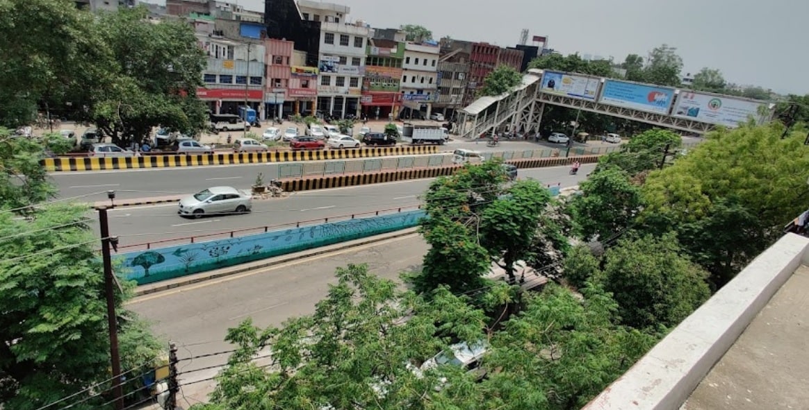 Patel Nagar_a city street filled with lots of cars and trucks