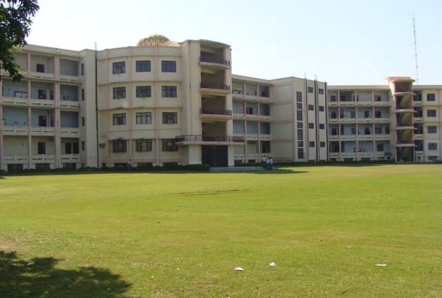 Rasulpur_a grassy area with a large building