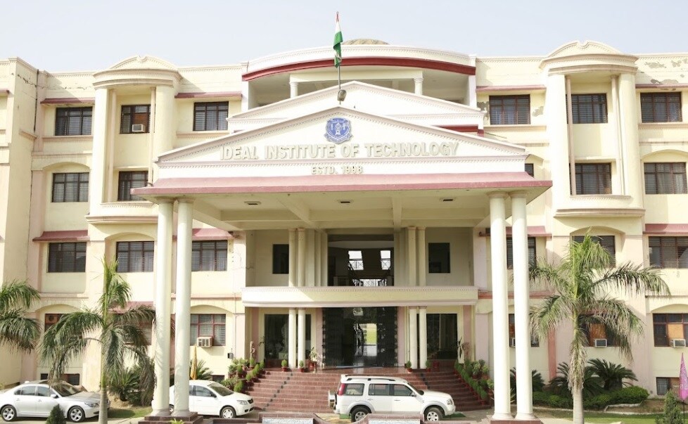 Rasulpur_a hotel room with a large white building behind it