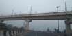 Sangam Vihar_a bridge over a bridge with a train on it