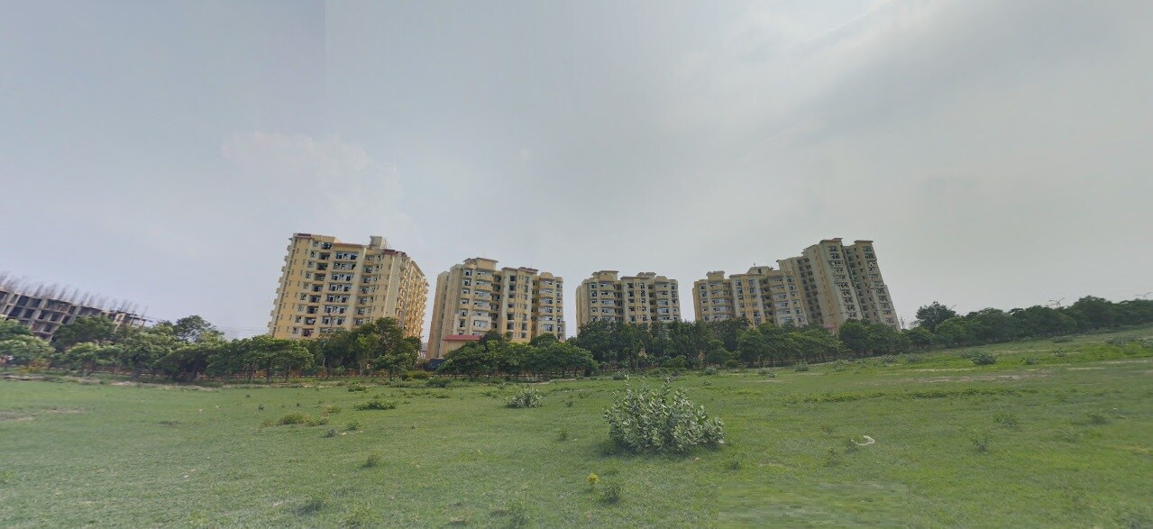 Vrindavan Garden_a cityscape of a city with tall buildings