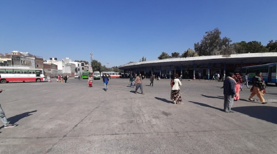 Adarsh Nagar_people walking around a parking lot