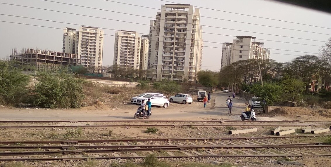 Ashok Vihar_people walking on the side of a road