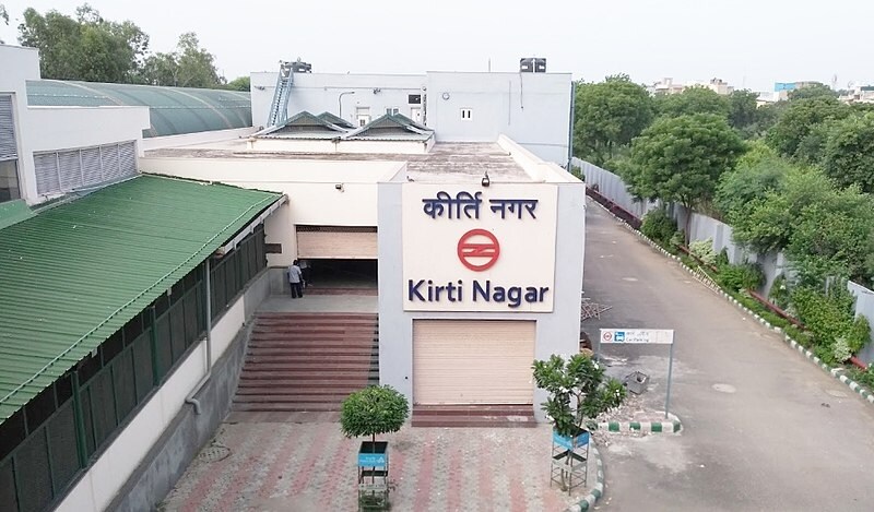 Kirti Nagar_a large building with a sign on the side of it