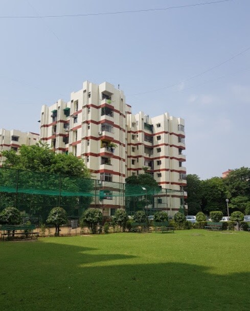 Patel Nagar_a large building that has a lot of trees around it