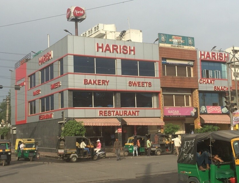 Prem Nagar_a city street filled with lots of parked cars