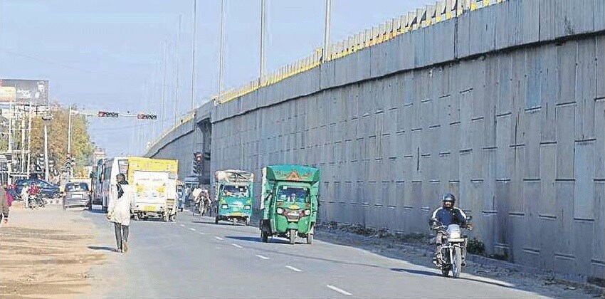 Rampura_a street scene with a man riding a bike