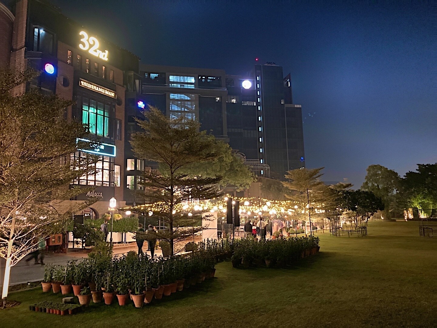 Sector 15_a city street at night with tall buildings