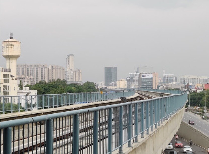 Sector 26_a train crossing a bridge over a river