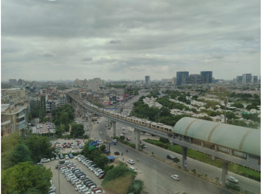 Sector 26_a train is going down the tracks in the city