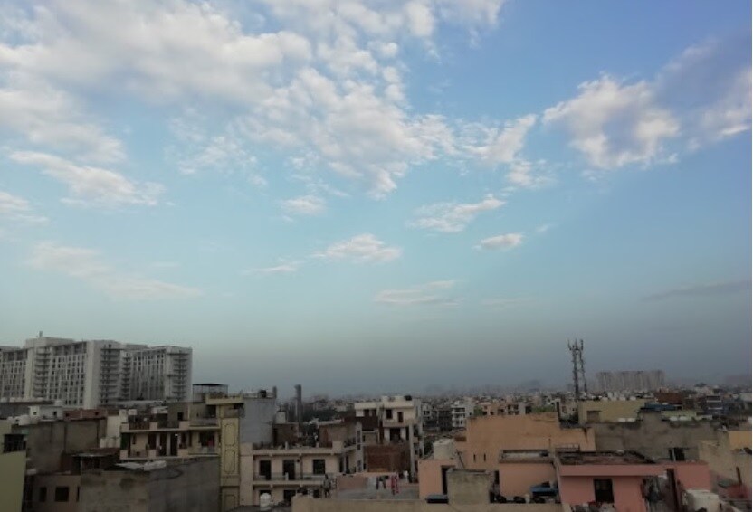 Sector 38_a city with a lot of buildings and a sky background