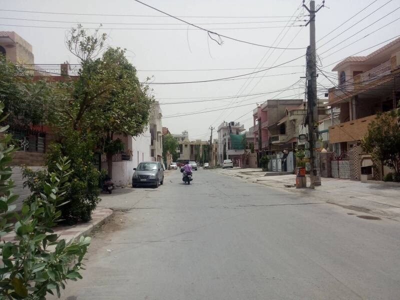 Sector 4_a person riding a motorcycle down a street