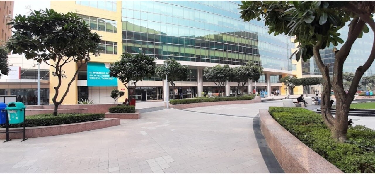 Sector 46_a large building with a clock on the side of it