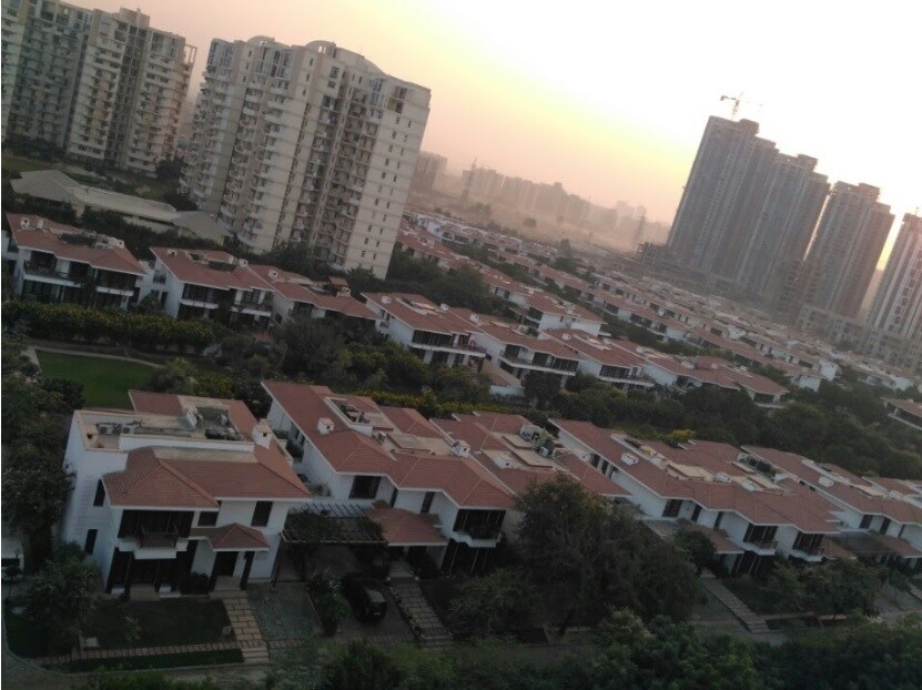 Sector 48_a large city with buildings and a sky background