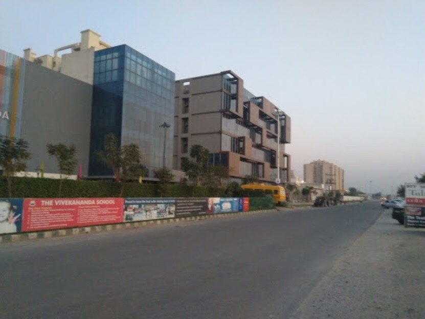 Sector 70_a city street filled with lots of parked cars