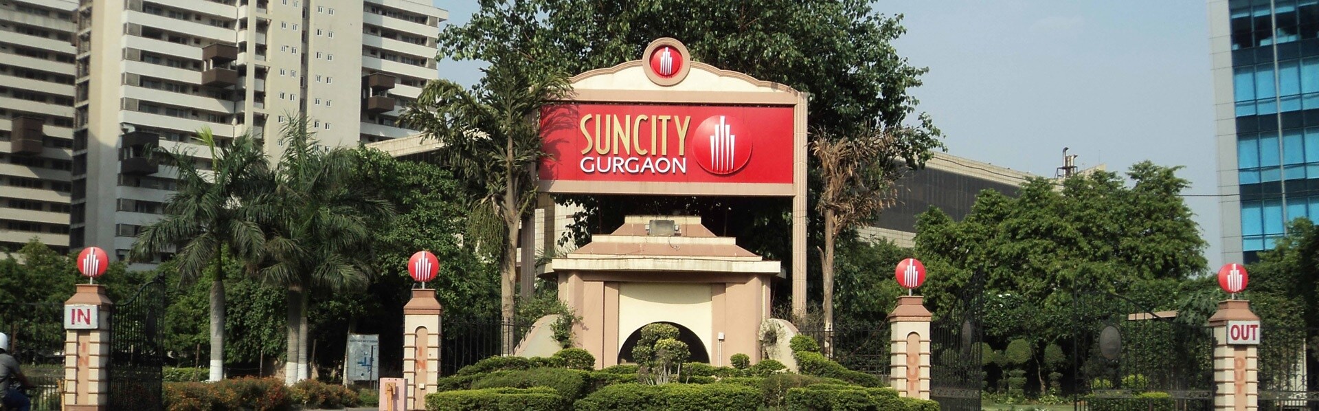Suncity_a large building with a clock on the front of it