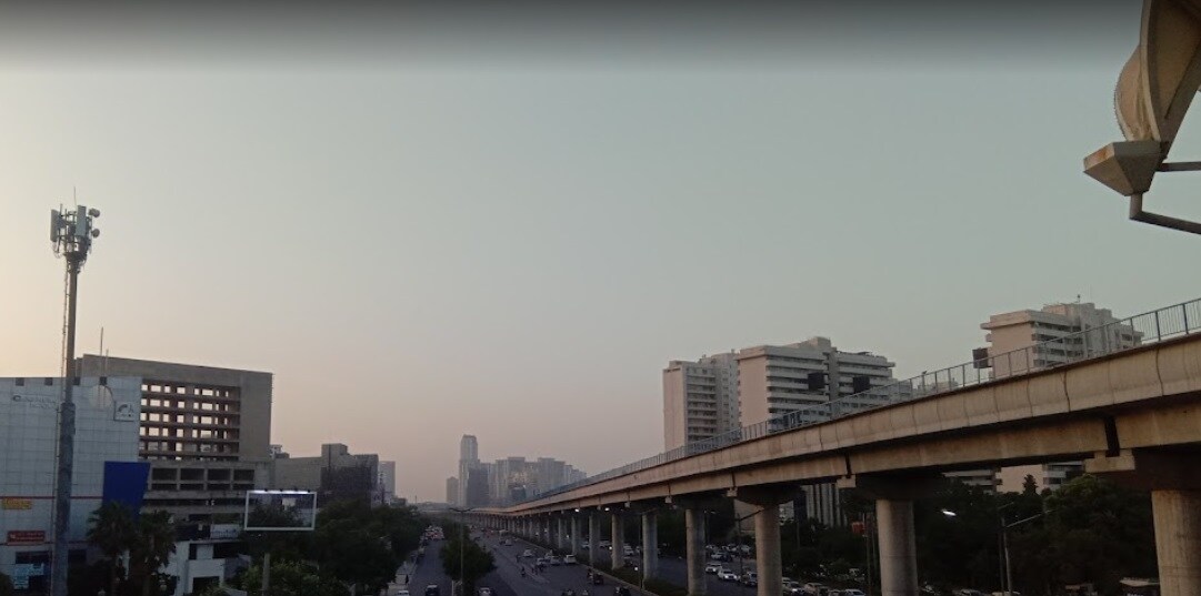 Suncity_a city street with a bridge over it