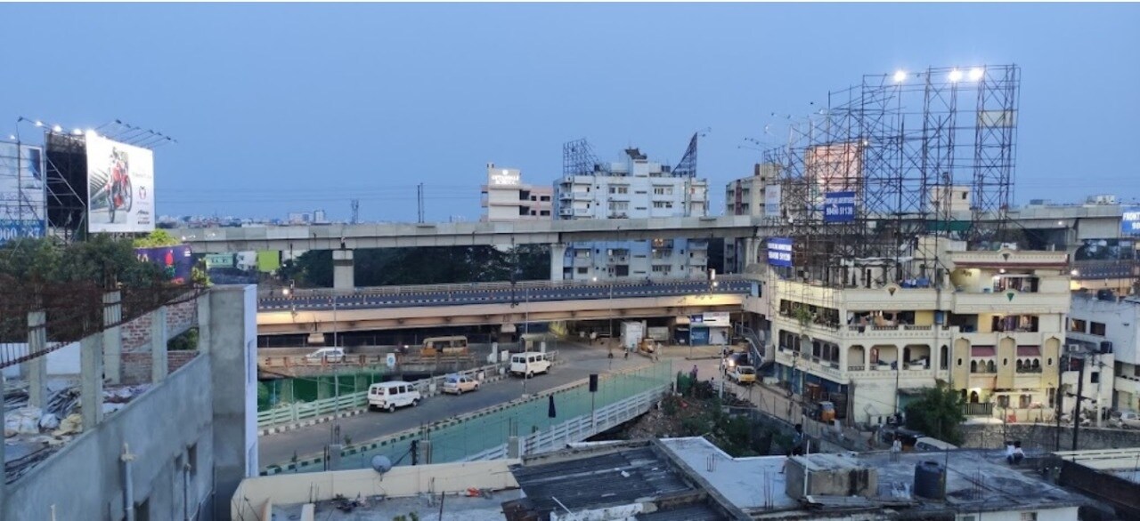 Begumpet_a large building with a train going by