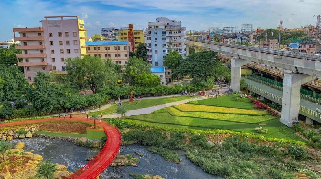 Begumpet_a train crossing a bridge in a city
