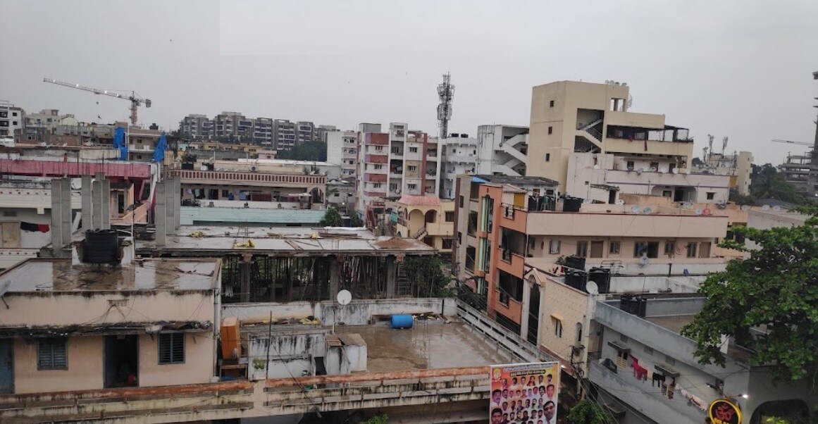 Erragadda_a city street with buildings and buildings