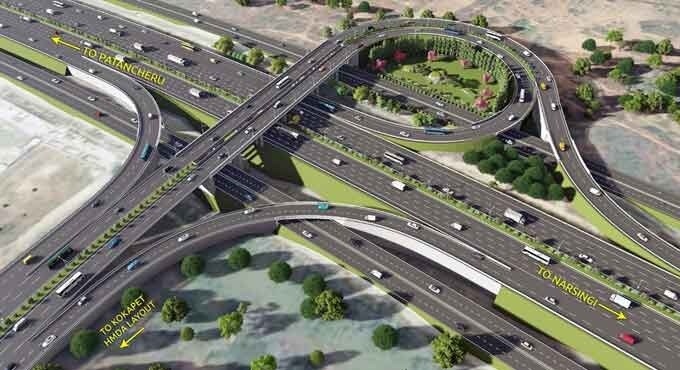 Kokapet_a city street filled with lots of traffic