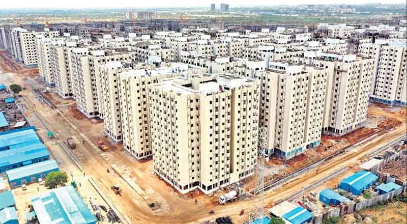 Kollur_a large city with lots of buildings and a sky background