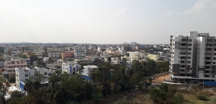 Kompally_a city with lots of tall buildings and trees