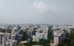 Miyapur_a city with tall buildings and a sky background