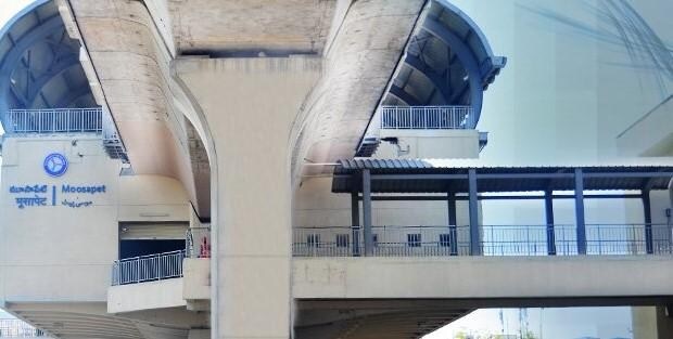 Moosapet_a train is going down the tracks at a train station