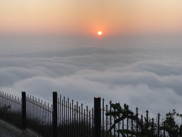 Nandi Hills_an aerial view of a city skyline with a sunset