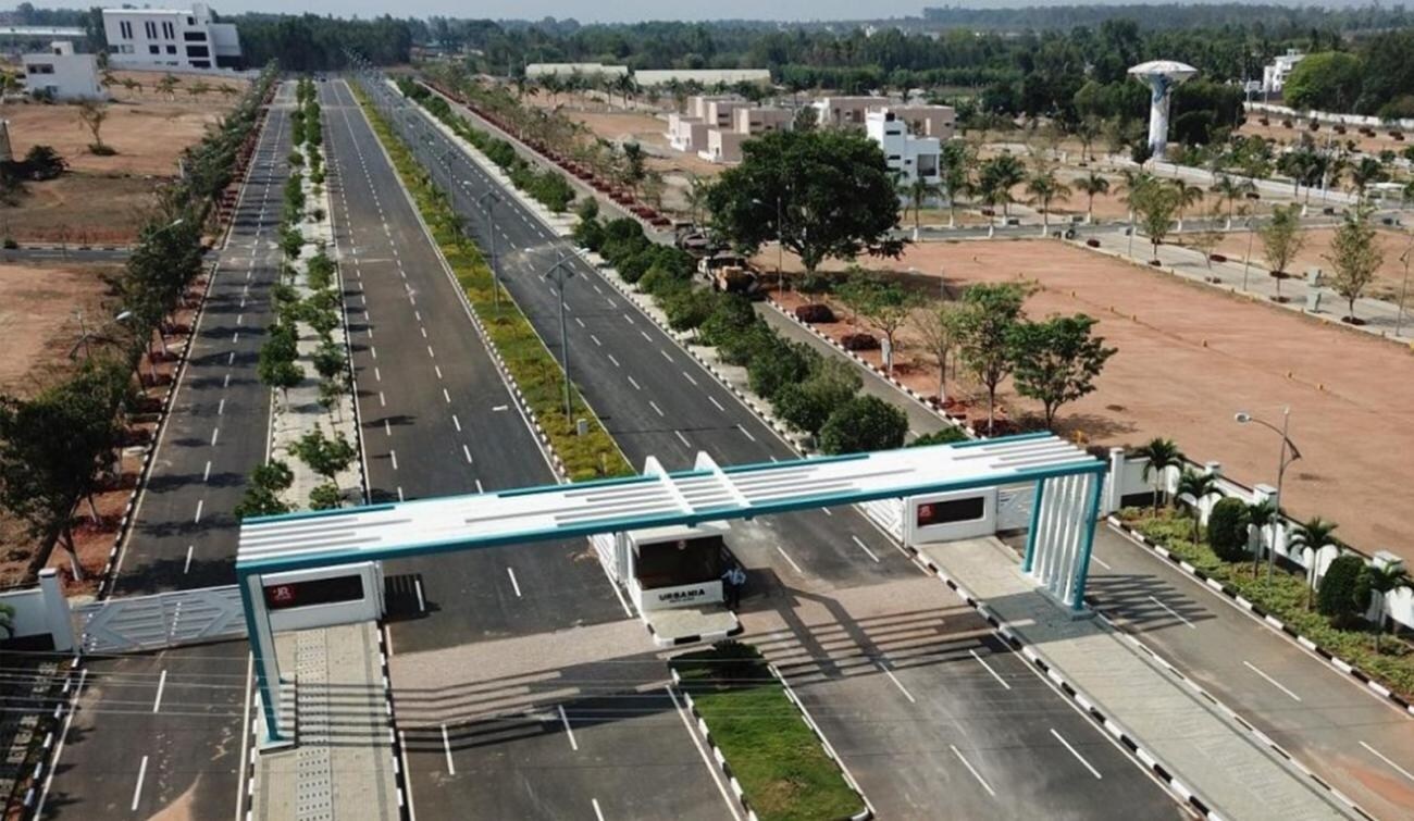 Nandigama_an aerial view of a building with a train on it