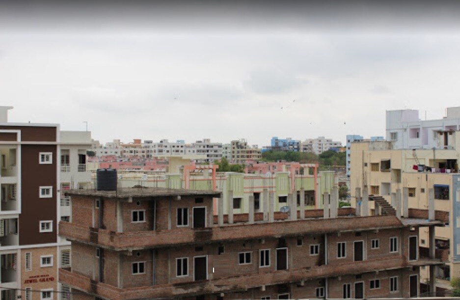 Nizampet_a large building with a building on top of it