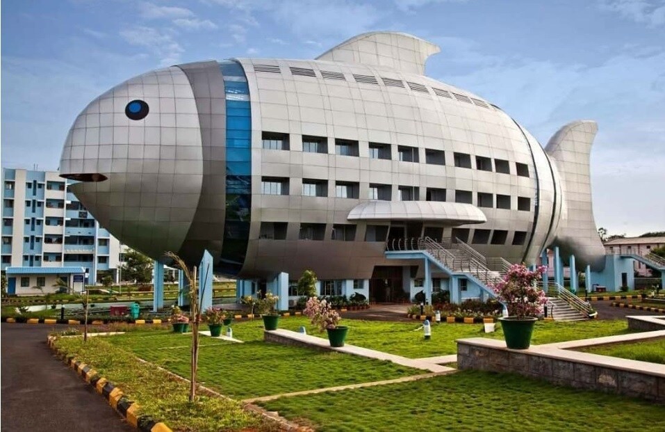 Shamshabad_a large building with a large statue of a man on top of it
