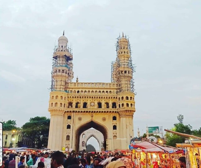Srinivasa Nagar_"a large building with a clock on its side"